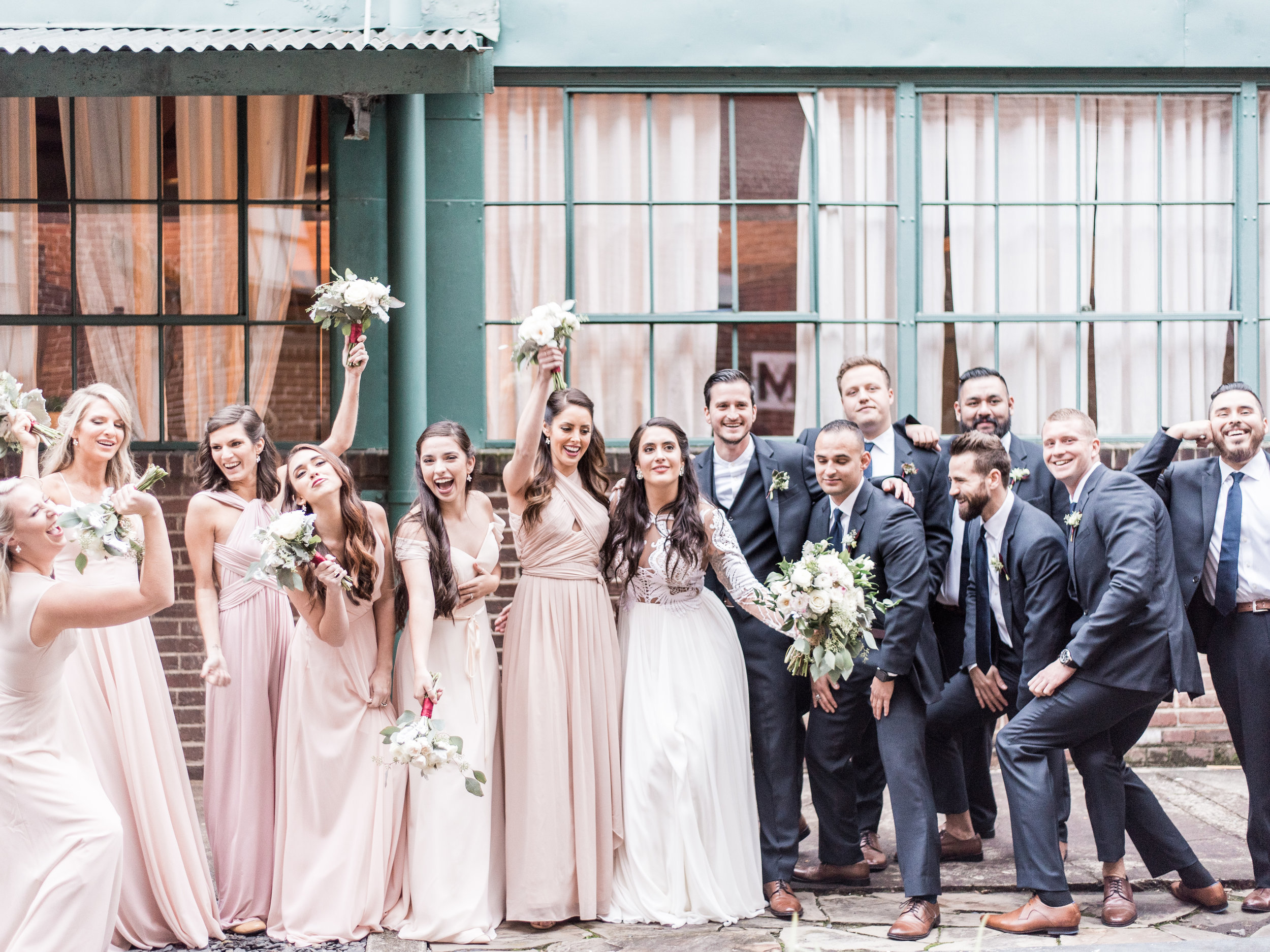 Nude and grey wedding colors with bridesmaids wearing mismatched dresses