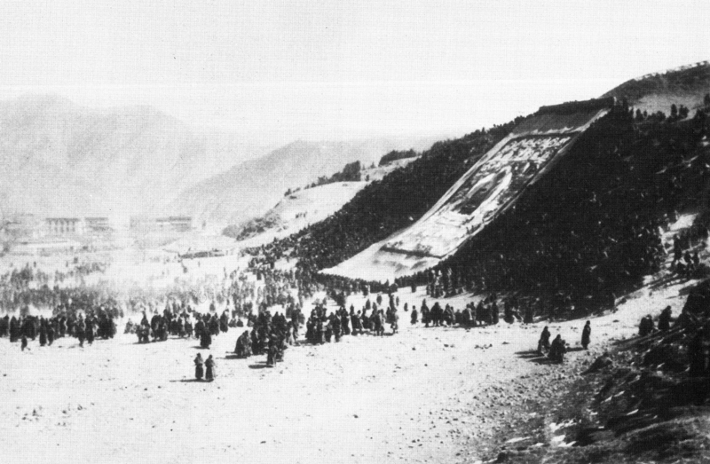 Large appliqué thangka unrolled on a hillside at Labrang in Amdo, Eastern Tibet, c.1930.