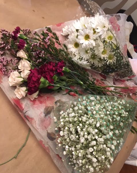 Next I needed some flowers! You will need some greenery, along with flowers of your choosing! I wanted the main focus to be these deep magenta flowers with the ivory flowers to accent them. Helpful tip: buy more flowers than you need!