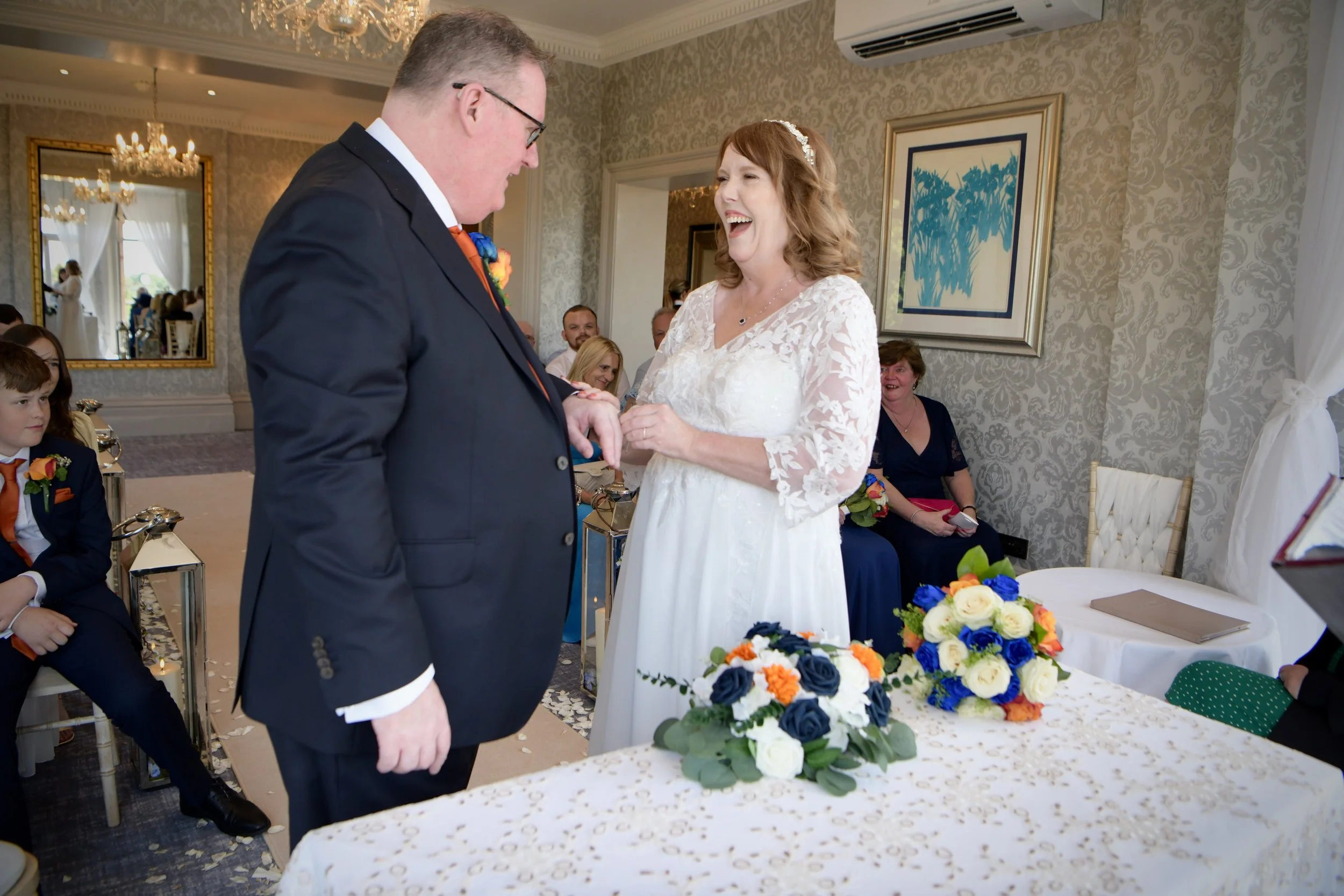 Emotional moment as a bride and groom exchange wedding rings during a civil ceremony, photographed by a professional London wedding photographer.
