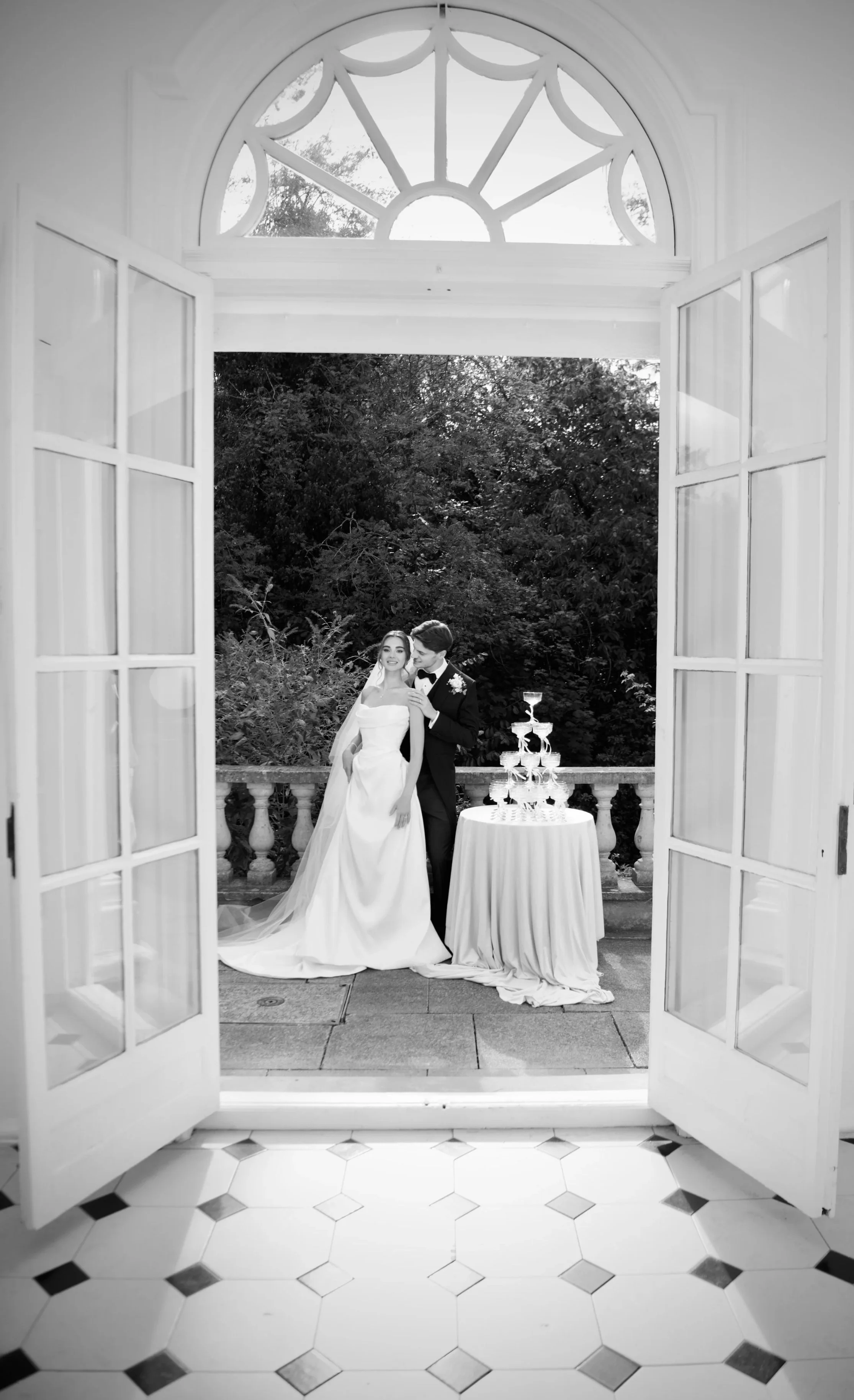 Bride and groom admiring the champagne tower