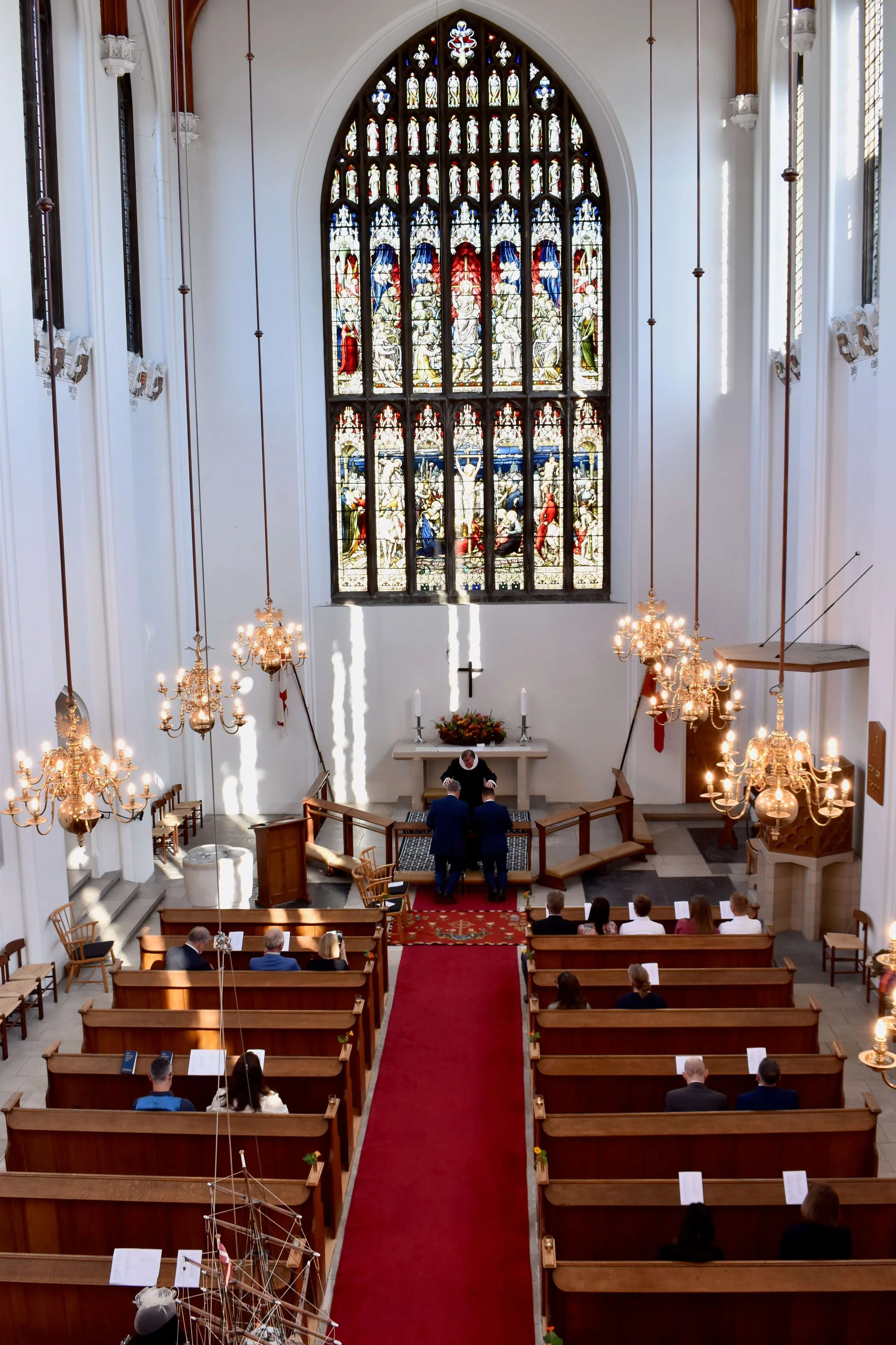 A sacred moment framed in stained glass—vows made under history’s gaze.
Keywords: church wedding ceremony, stained glass backdrop, same-sex marriage vows, intimate wedding moment, traditional wedding venue