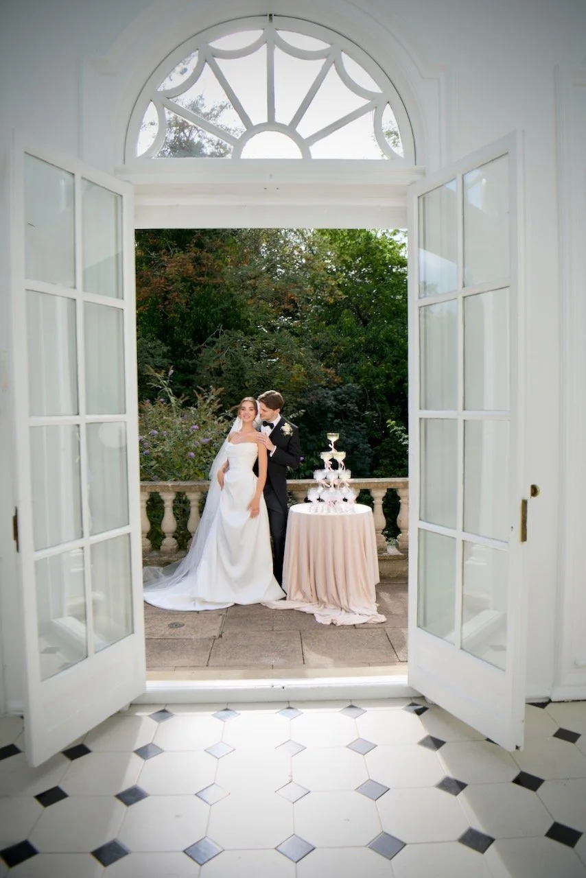 Bride and groom admiring the champagne tower