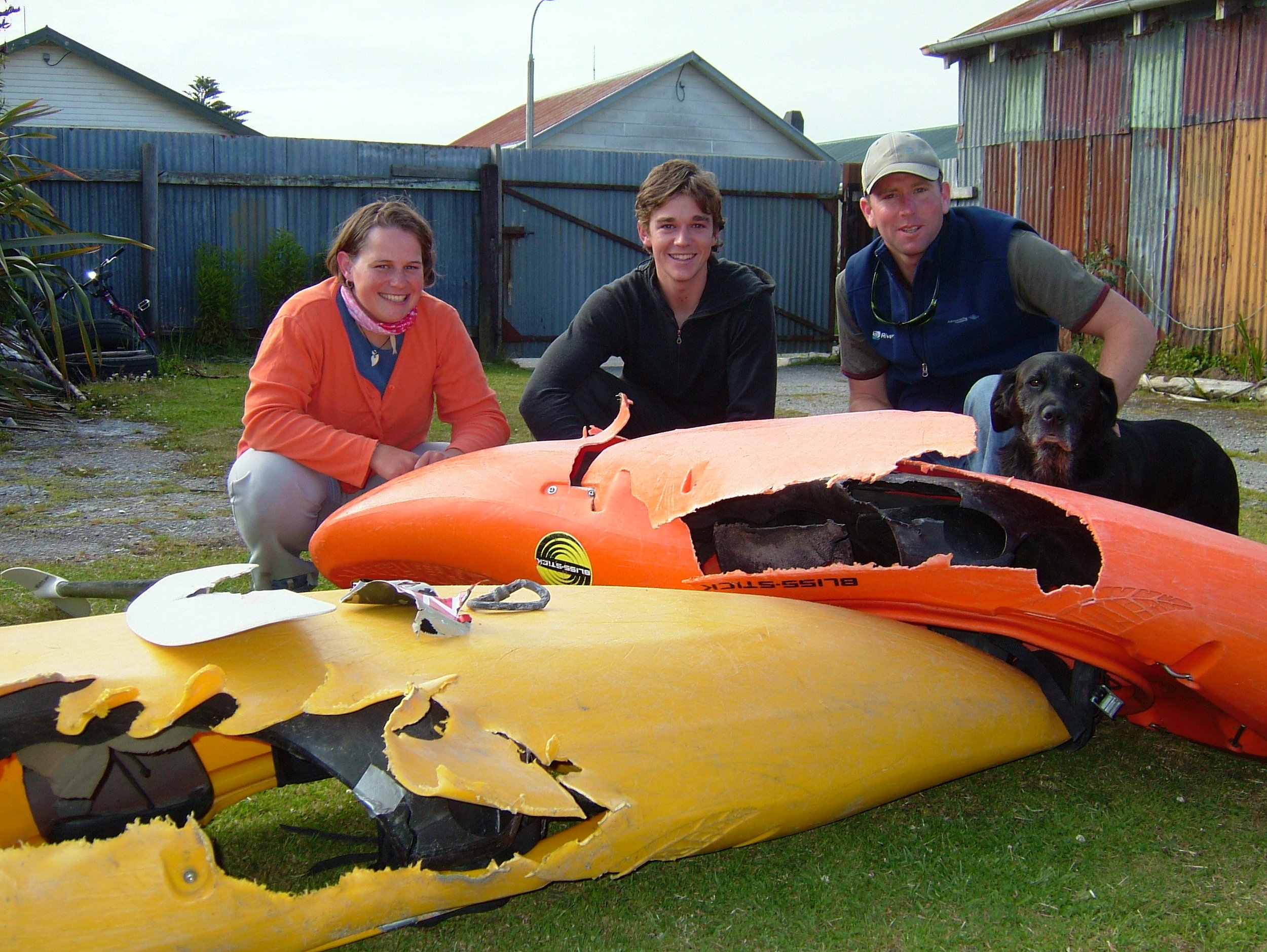 Irene, Ricky, Jett and I. This is the damage the tail rotor did when it sliced through the boats. Lying on top is a carabiner that was on my life jacket in the machine, contorted by the heat. Also a piece of the fuselage. 