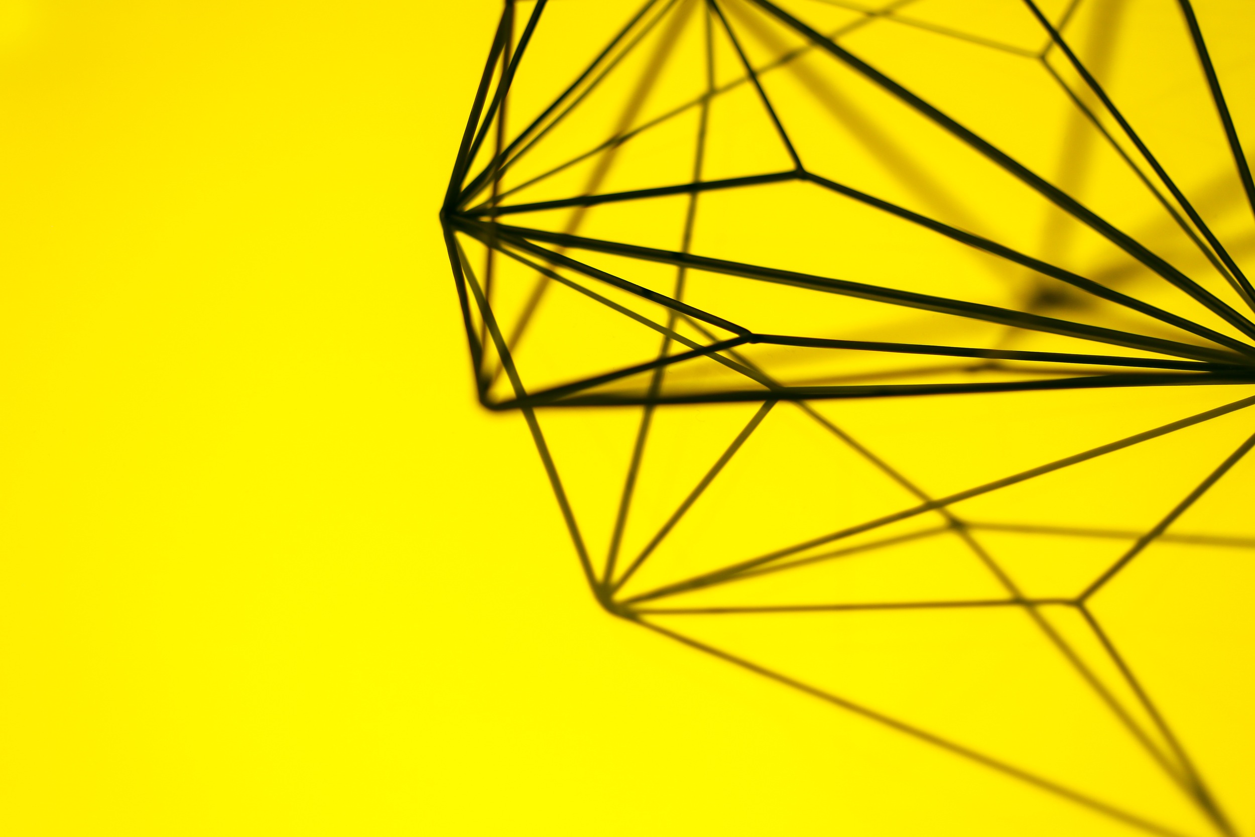 designed-metal-wire-structure-on-yellow-background