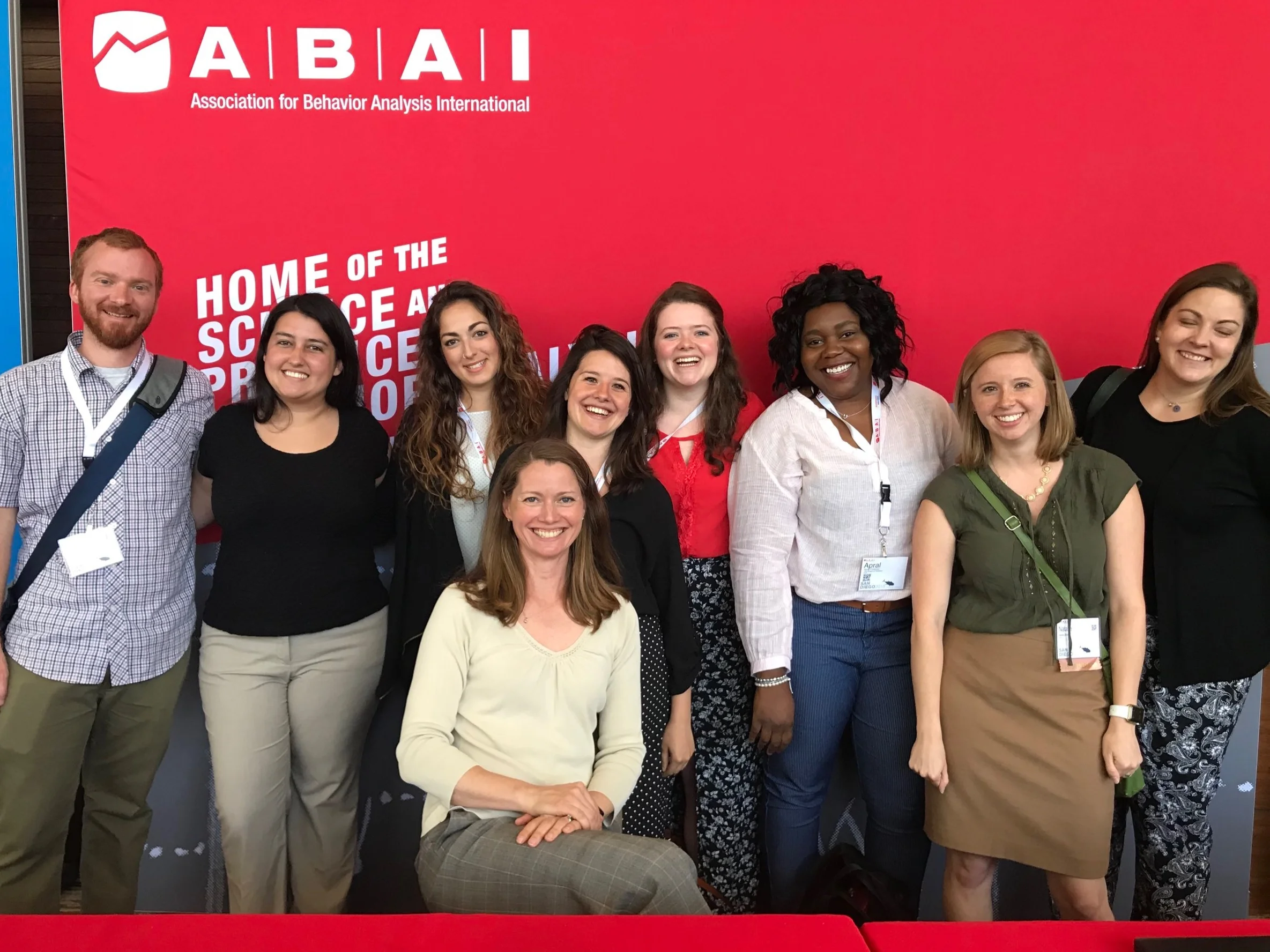 Current and former members of the lab get together at ABAI 2018. Left to right: Michael Mathews, Claudia Diaz-Salvat, Lucie Romano, Stephanie Jones, Catherine Williams, Apral Foreman, Natalie Shuler, and Aimee Giles (Claire, seated).