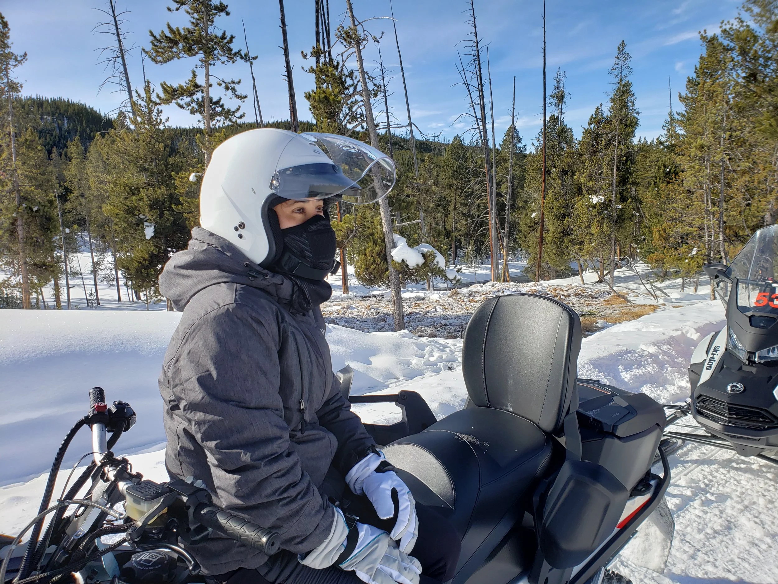 Sitting on a snowmobile in the freezing temperatures of Yellowstone National Park