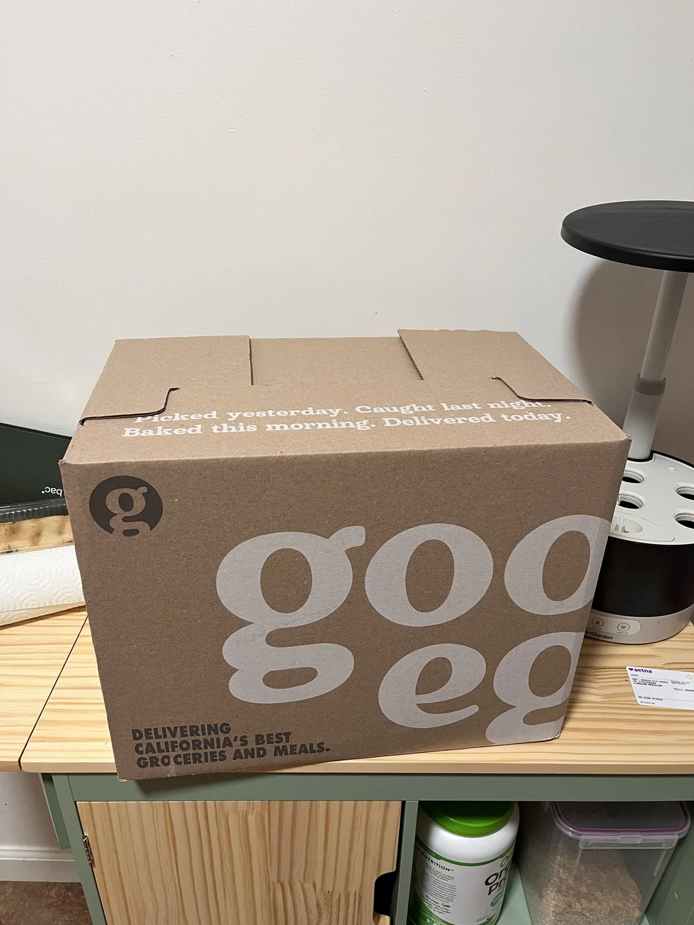 A Good Eggs cardboard delivery box on a kitchen counter
