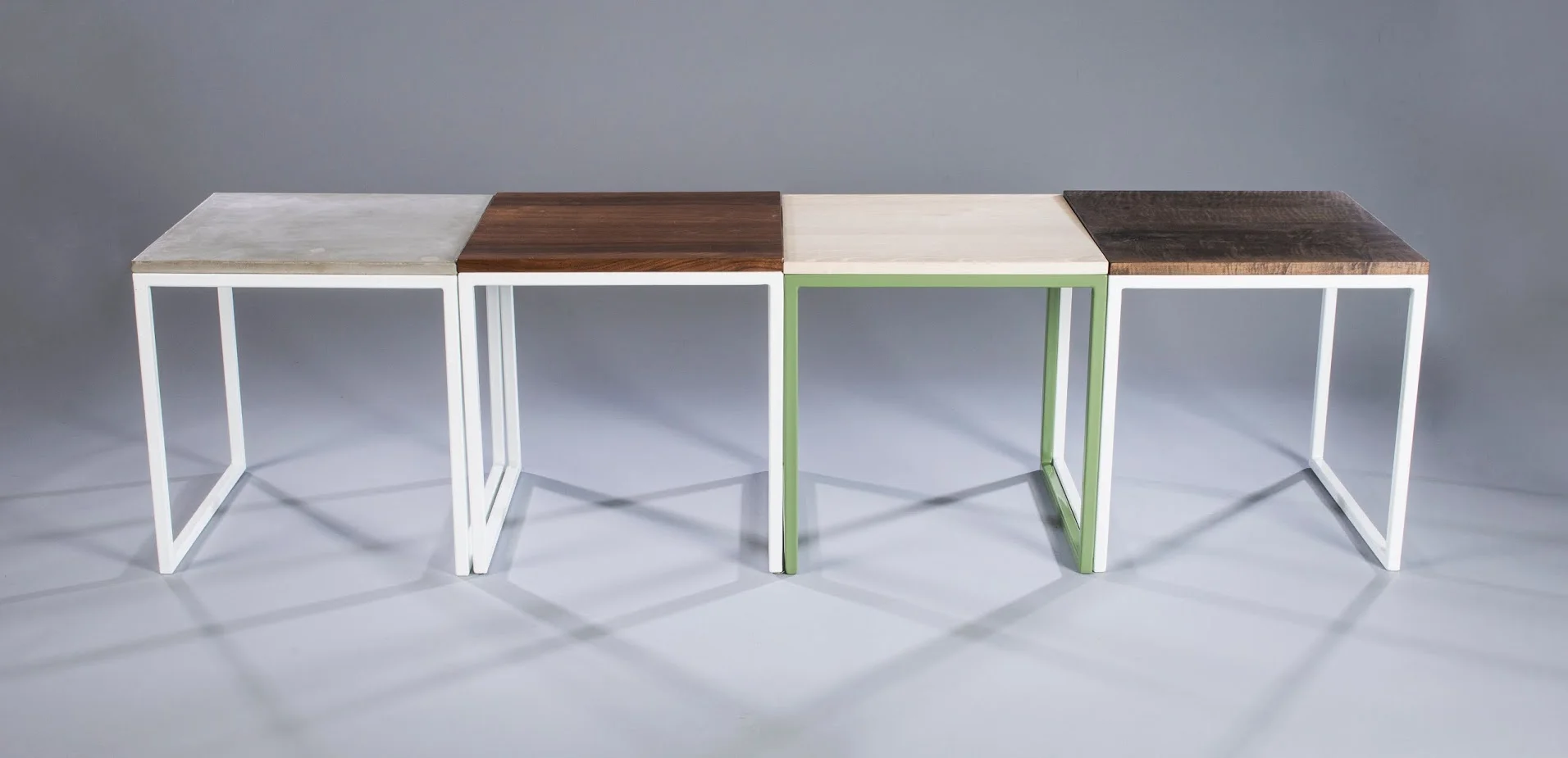   side tables,&nbsp; powder coated steel + cast concrete, walnut, bleached ash, oxidized curly maple 