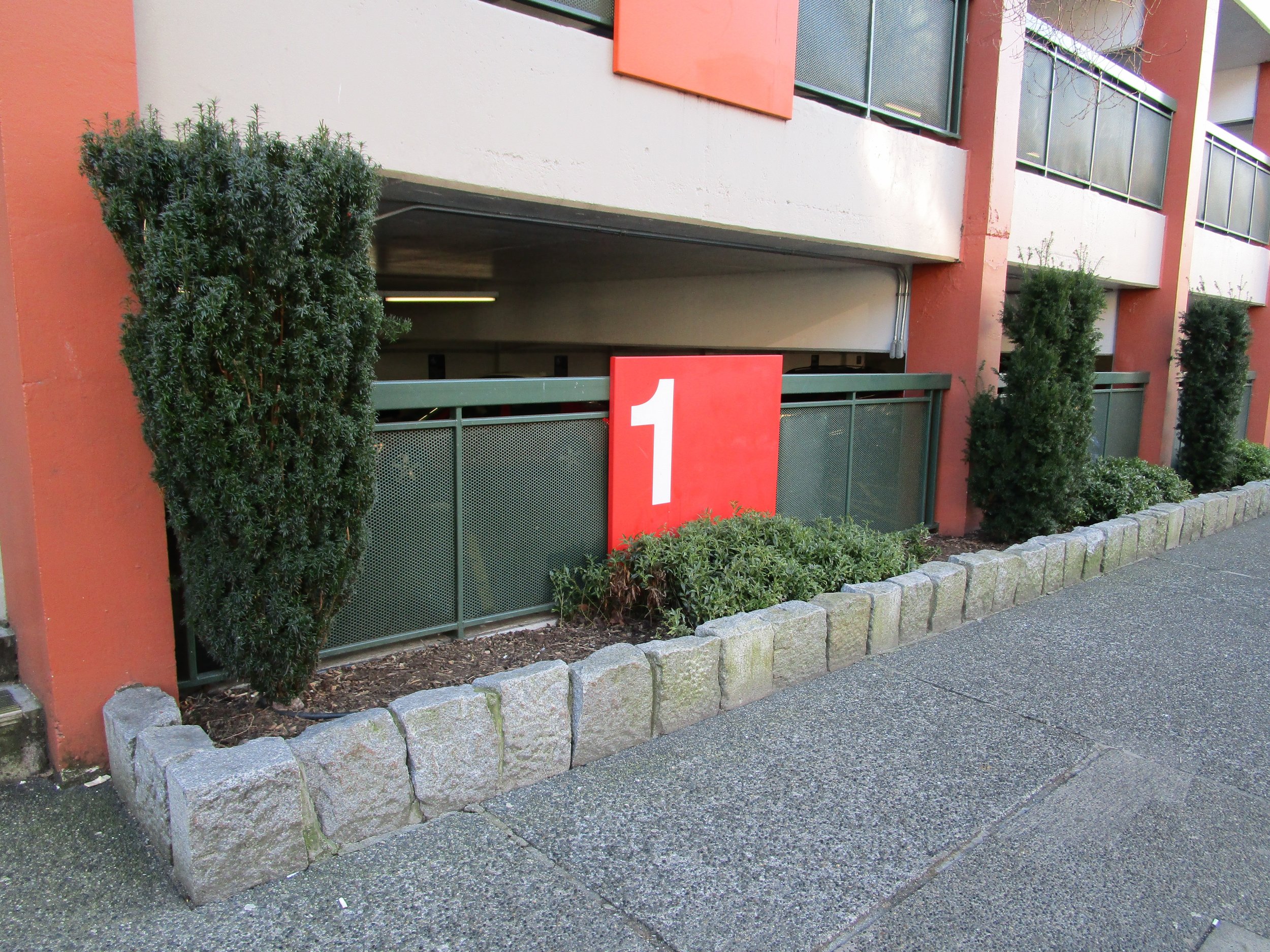 A lumpy rock wall outside the Yates Street parkade.