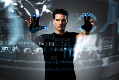 Tom Cruise reviews a Victoria development proposal for pre-crime. Image source .