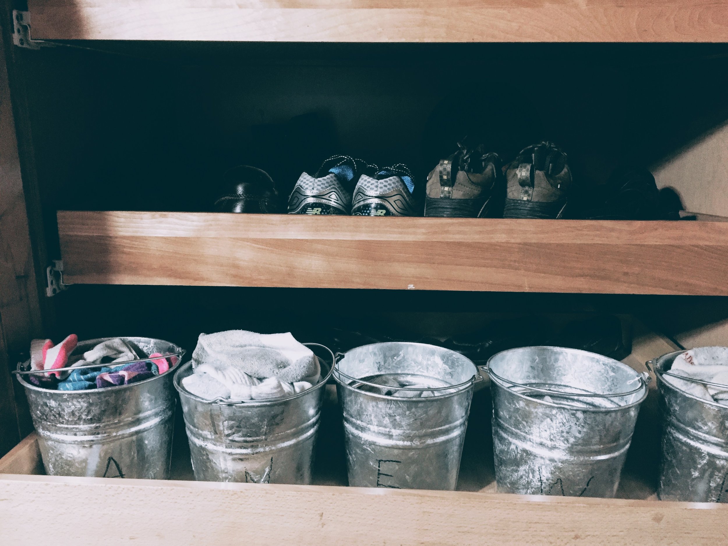 Socks are in little buckets placed in age-order by the door just below the shoes. This is a kitchen cupboard so it's not the normal usage but it works for us. 