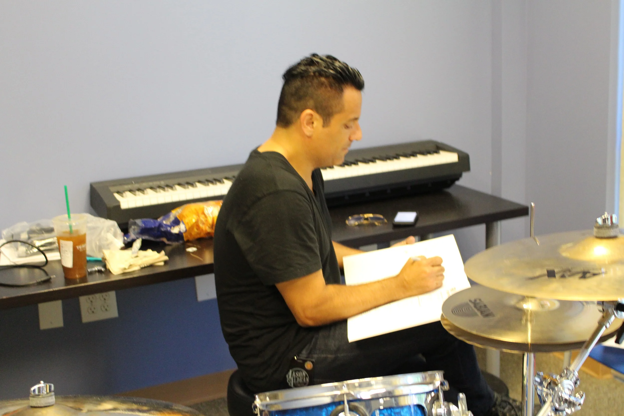 Rich signing Colin's copy of "FUNdamentals of Drumming for Kids"