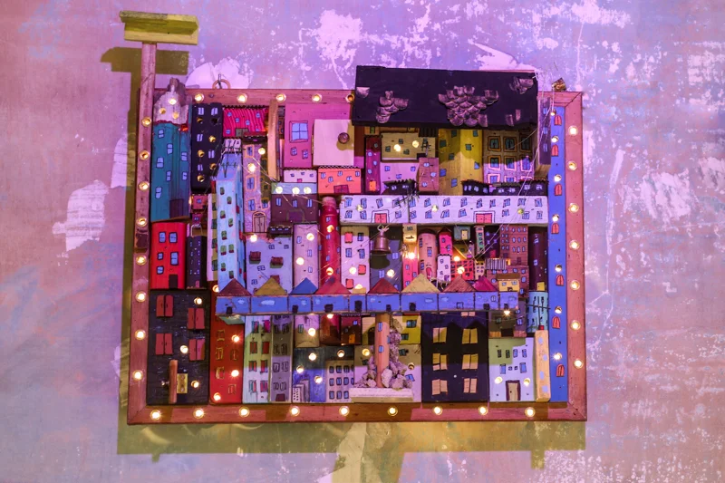 City of Scraps 25 x 24 in. Acrylic on found wood and string lights