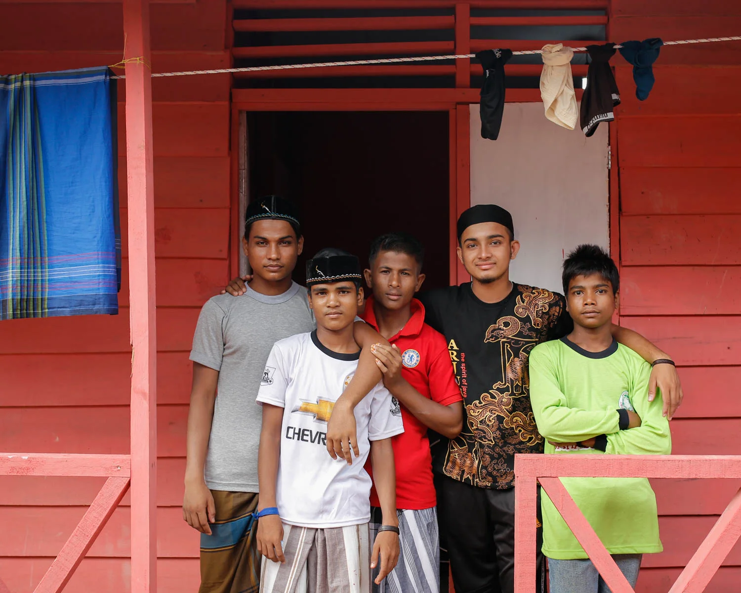 Hasson and his new, temporary family at the refugee shelter in Langsa, Indonesia.