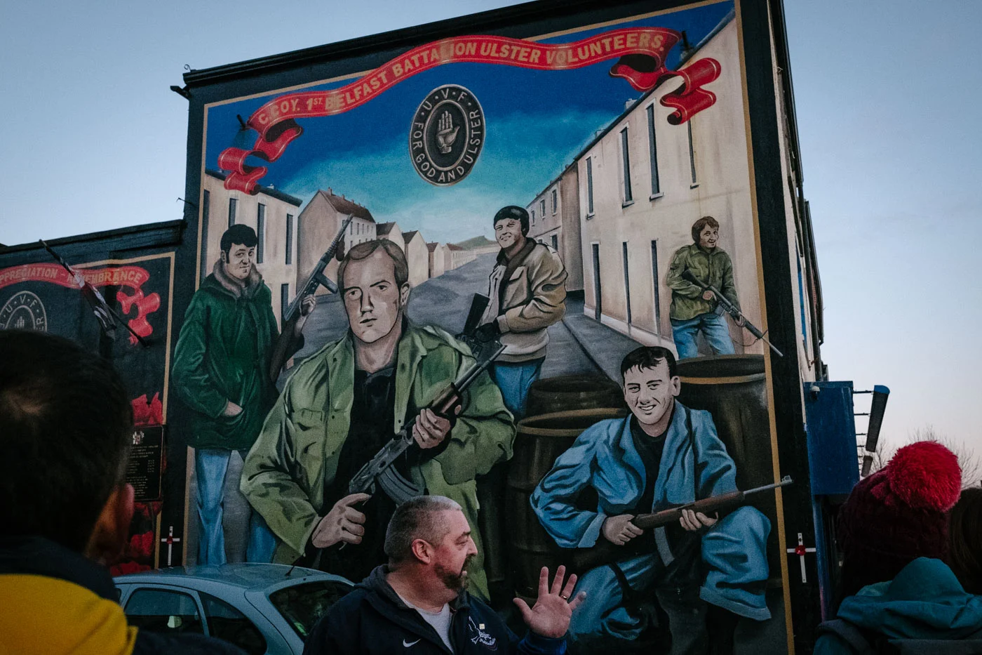 A mural of smiling loyalist paramilitaries on Shankill Road