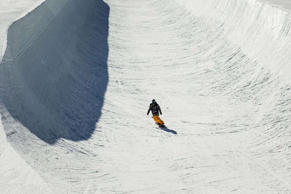 Someone snowboarding down an Olympic course