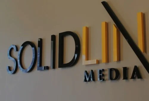 Raised business lettering on a wall
