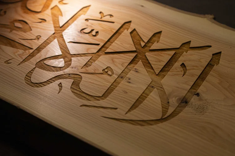 Decorative script lettering cut from wood