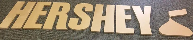 Cut lettering arranged on a work surface