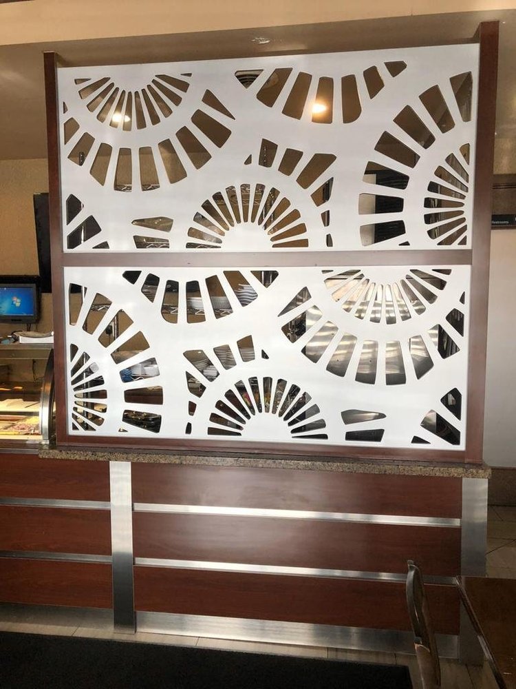 White partition panel with geometric cutouts
