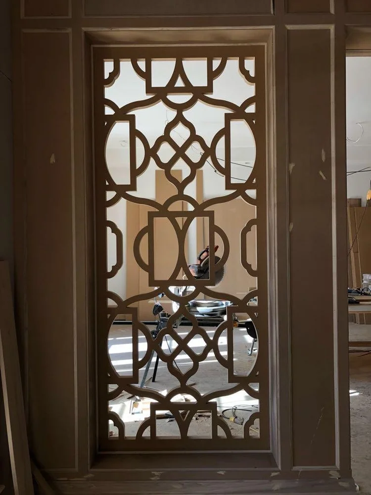 Decorative panel installed within a doorway