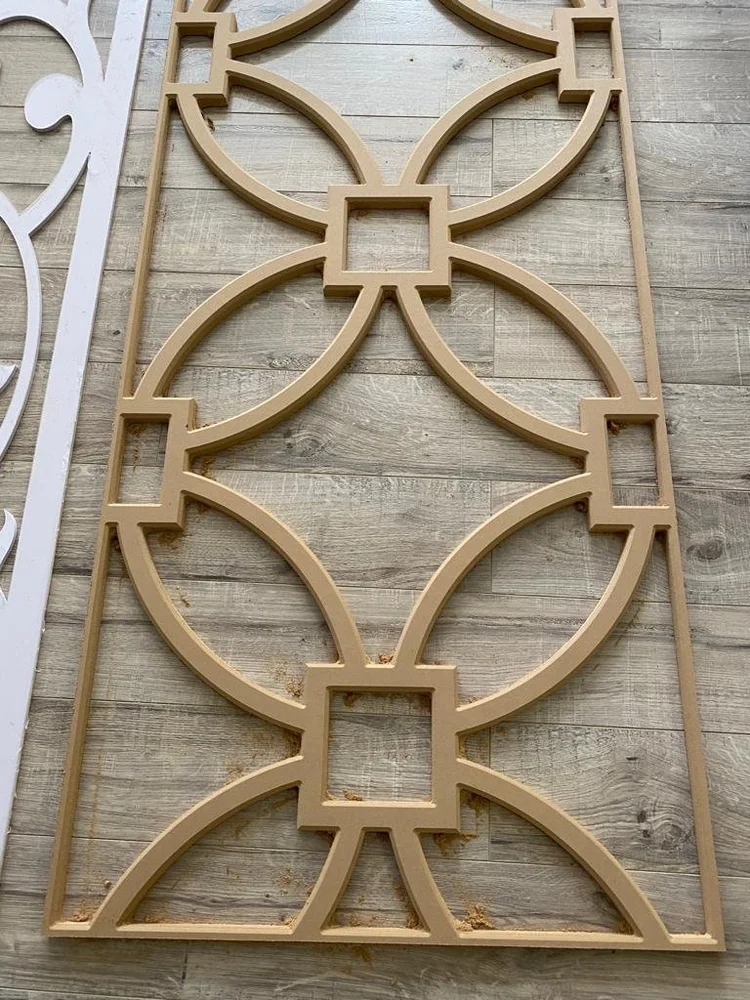 Decorative wood panel with repeating circular cutouts