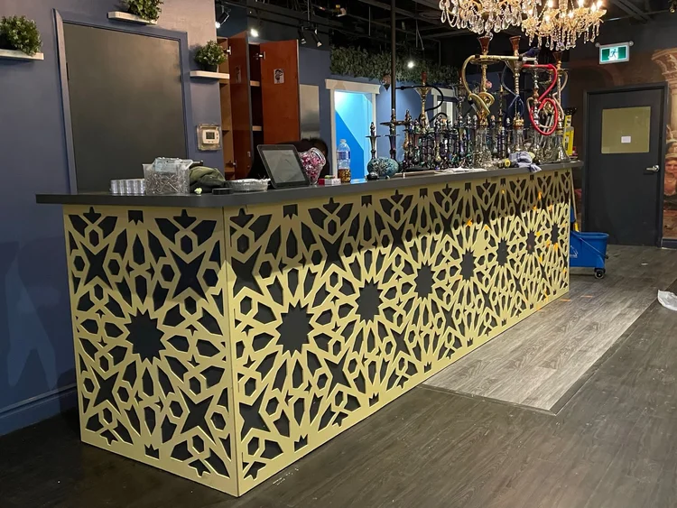 Ornamental panels around a restaurant counter
