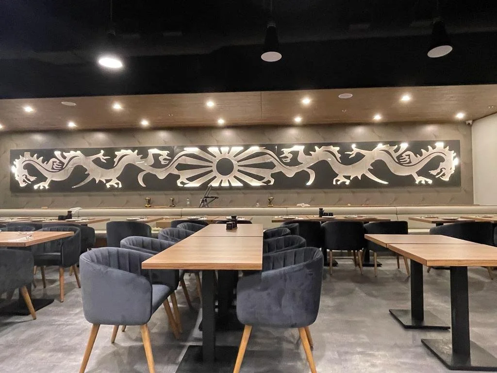 Decorative wall panels above restaurant seating