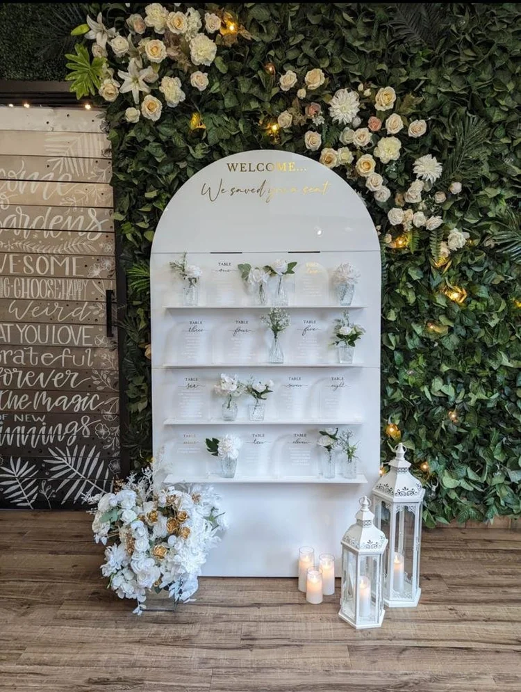 White event display with shelves and floral decoration