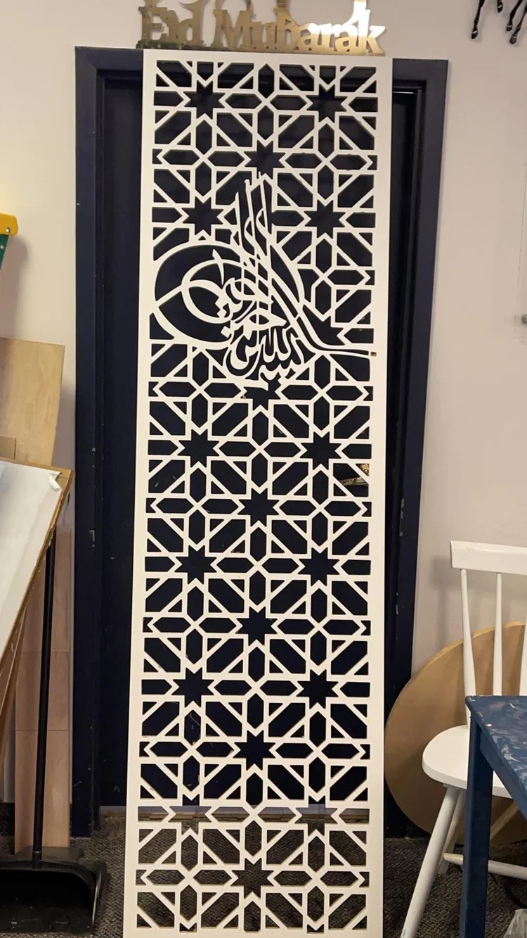 Tall decorative partition with an intricate cut pattern
