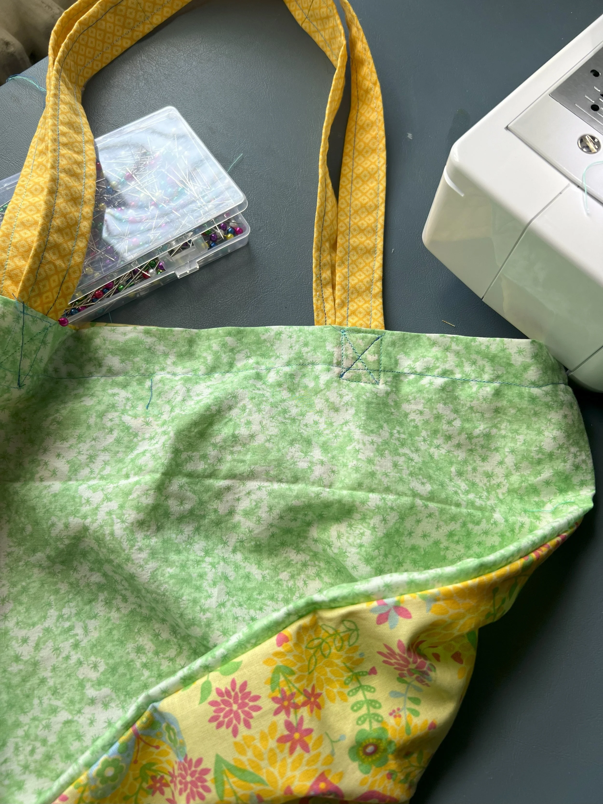 green and yellow tote with flowers