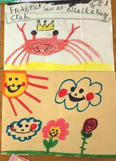 toddler drawings of crab, flowers, sun and clouds with smiley faces