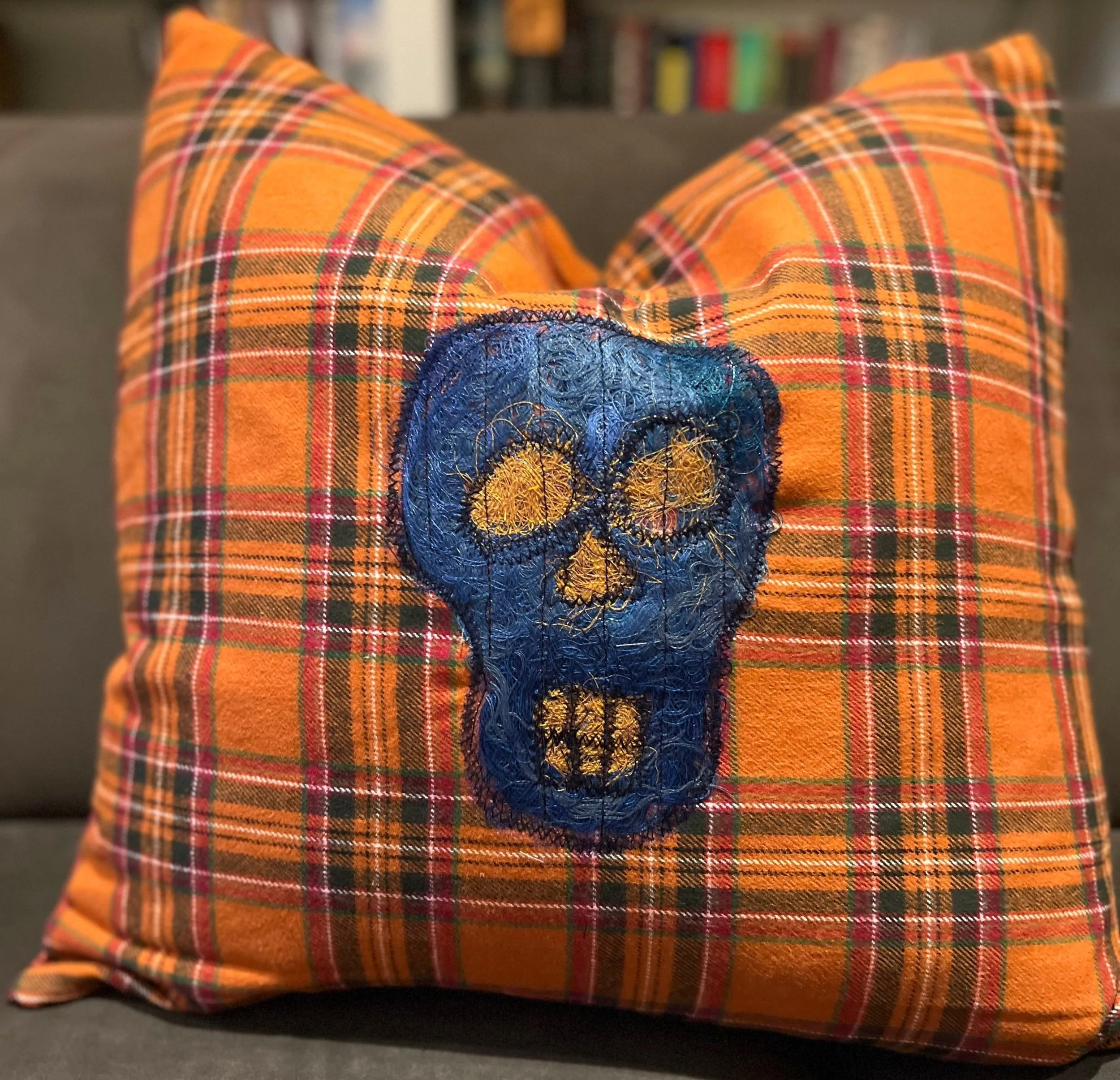 orange plaid halloween pillow diy with blue thread and tulle skull