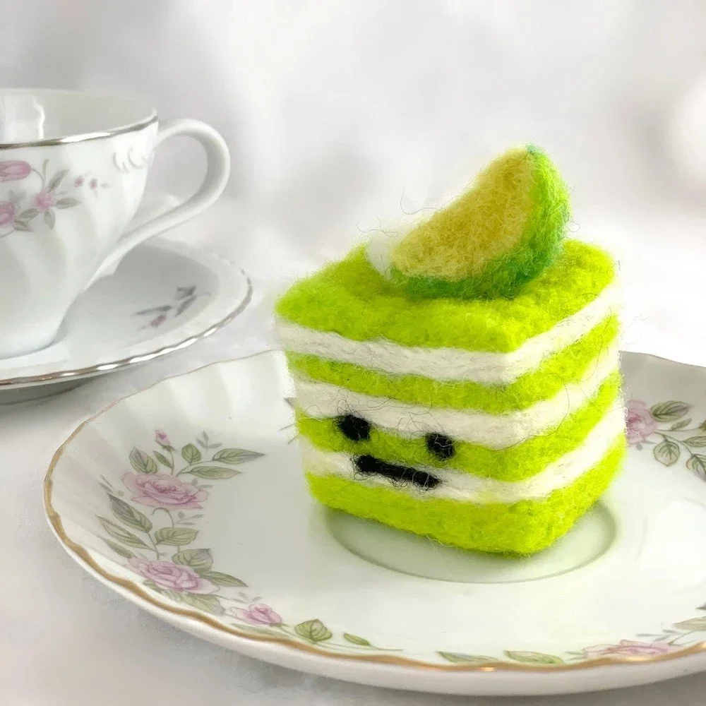 neon green cake with face felting with lime