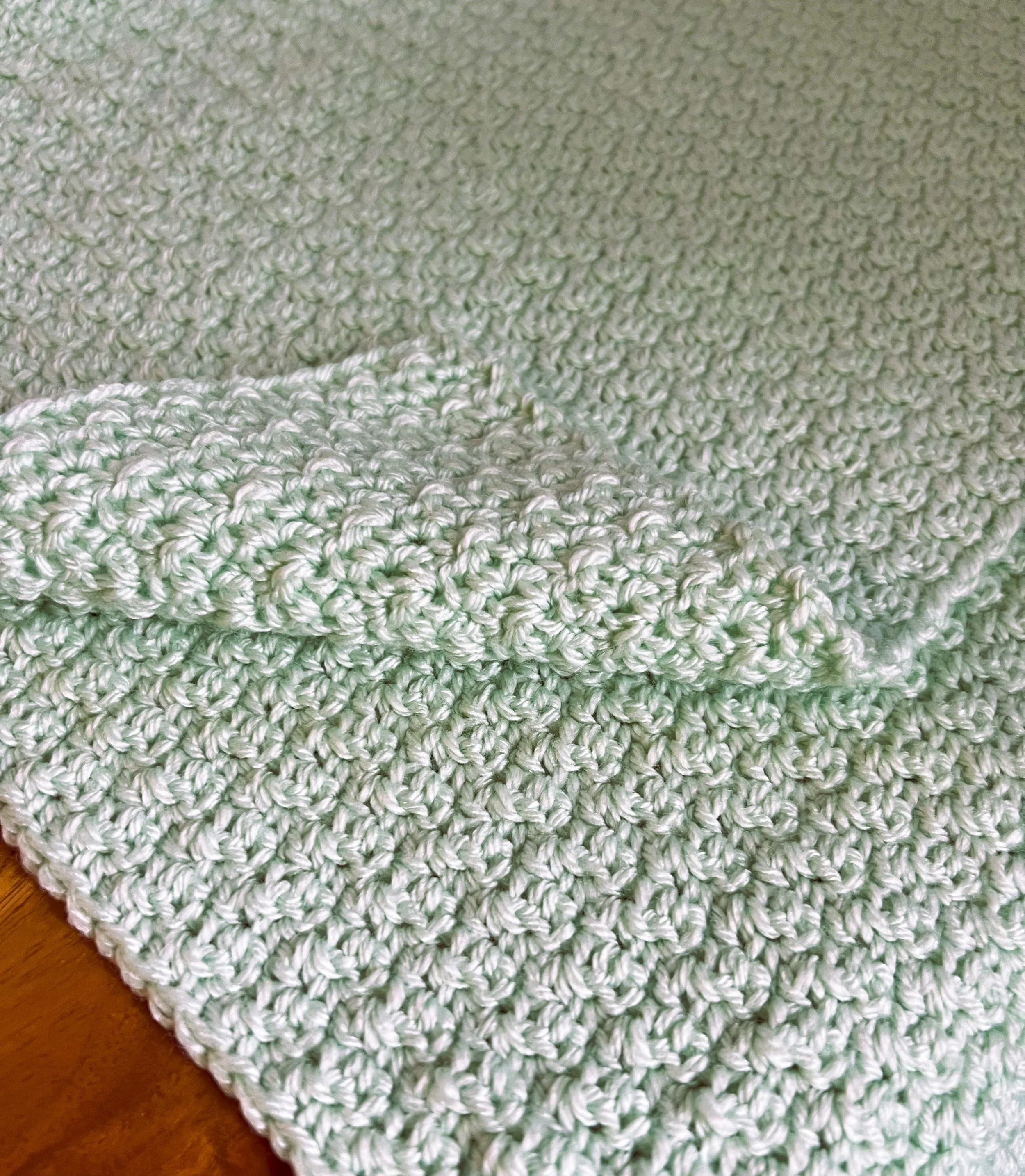 soft pastel green crocheted afghan