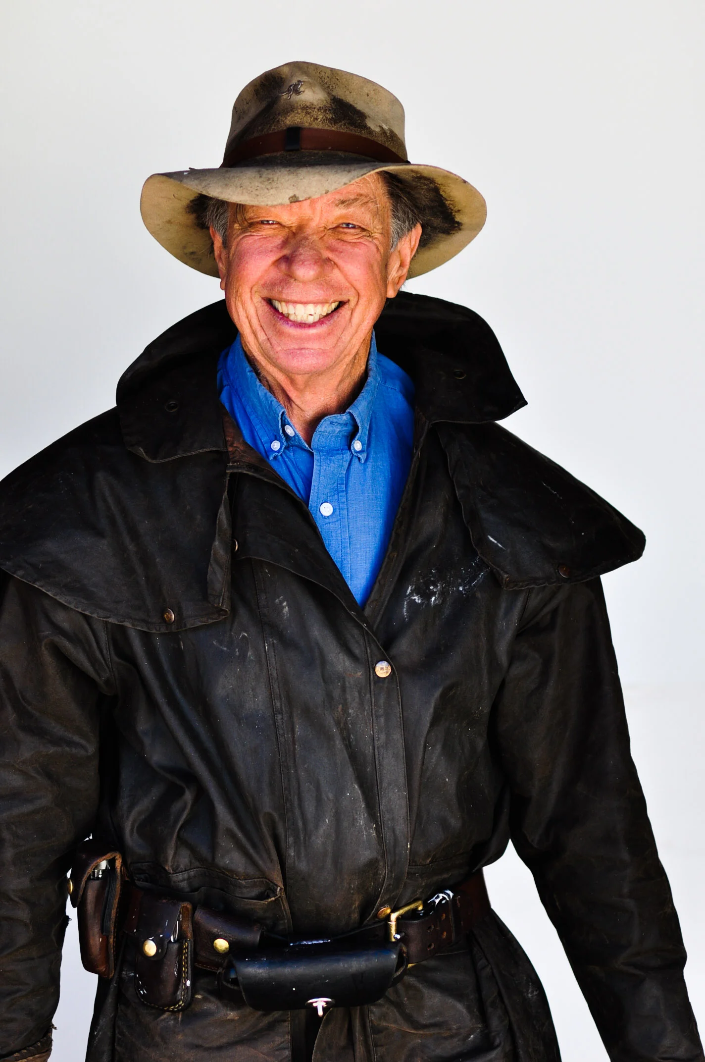I love to ride in oilskin coats, because if it is cold, they cut the wind attracted by a gallop! If it is raining, the coat keeps you dry. This is an amazing piece of equipment because the coat is long enough to go over your saddle, and down the side, so it traps the heat of the horse around your body. And if it gets hot, you can roll the thing up and strap it to your saddle. And if you want to take a nap under a tree, you can throw it on the ground and sleep on it! I also ride with tools, which I strap on the outside of anything I am wearing. Nothing really unusual: a small flashlight, a multi tool that contains a hoof pick, a box cutter (with a new blade always) and a small magnifying glass that I can uses to light a fire if need. If I know I am going to do something crazy I wear a helmet. Since my wife Linda entered the final stages of dementia, I have taken to also carrying a cell phone.