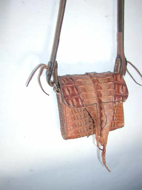 We can line any purse with crocodile, alligator or any other exotic hide you might like. Tell us and we will give you a quote, depending on how much skin you want to show, or what kind of skin. Prices vary according to availability