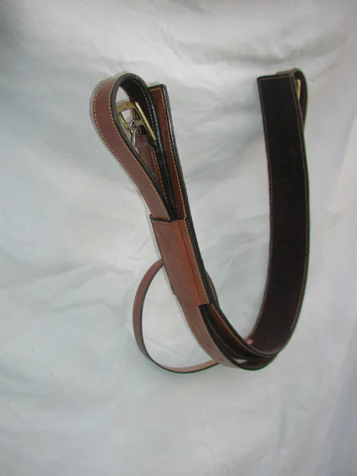 Back cinch with strap attached, brown or black. . Price, $99.