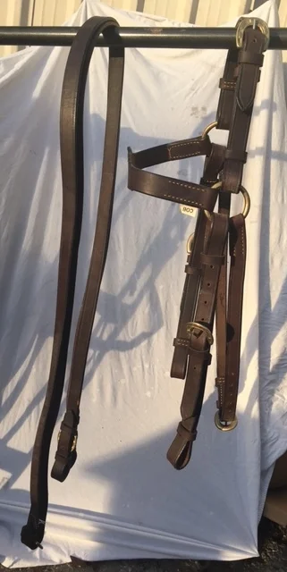 The Barcoo Bridle is actually an English-style headstall, but made with tougher leather for rugged use in the bush -- or on American trails! The life of this piece of equipment, if kept oiled, is about 20 years! Price with reins, $129