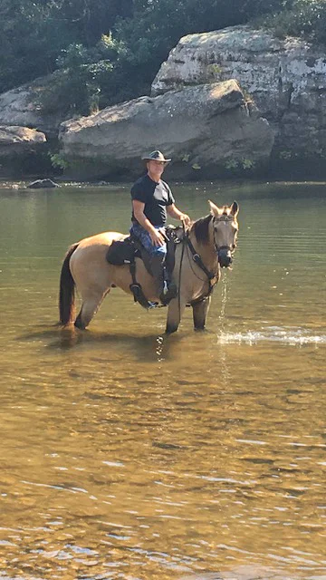 Jody and Remington in a river in a Patrol Poley