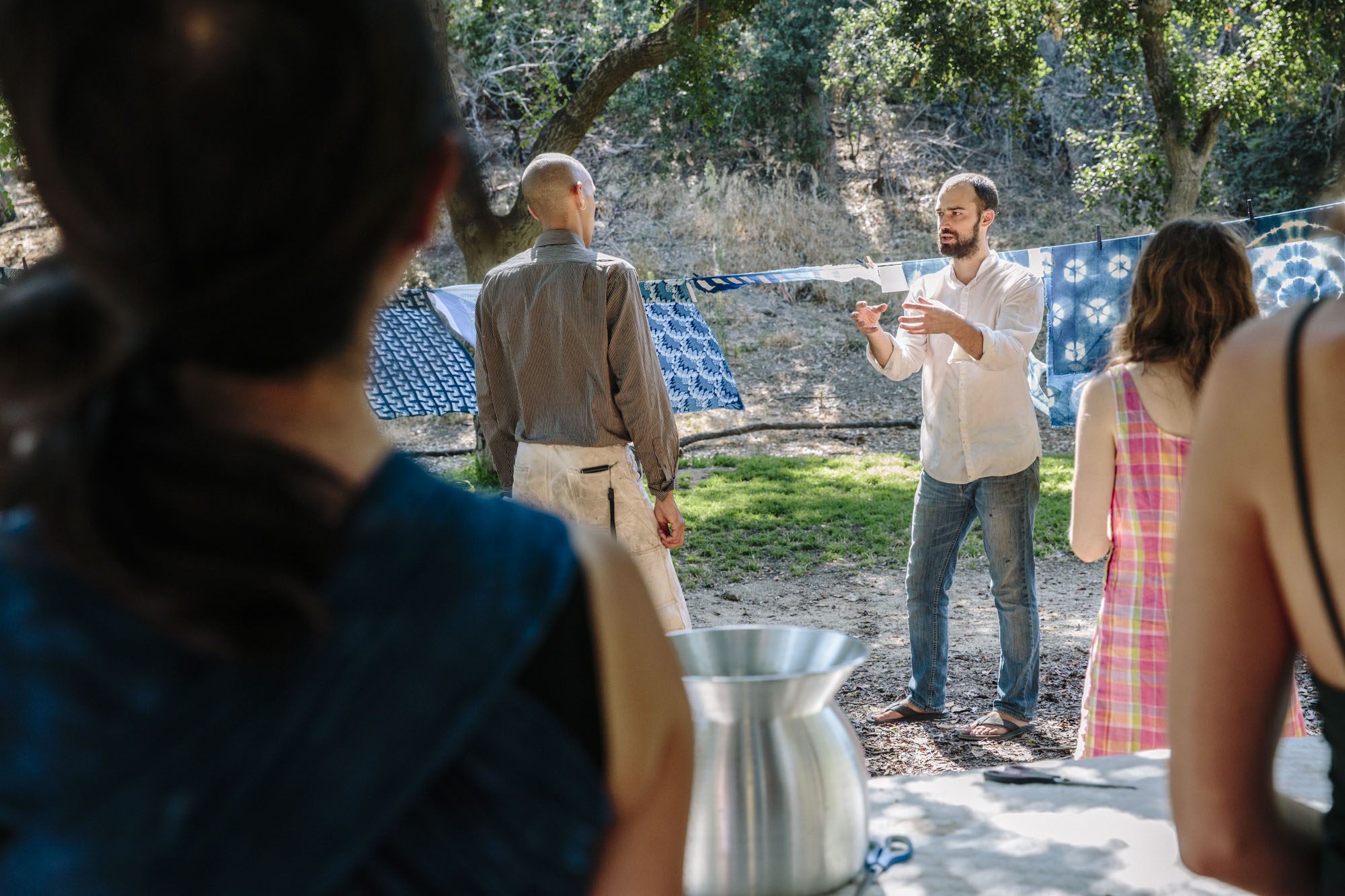 Graham Keegan Teaching Indigo Dye Workshop Outdoors.jpg