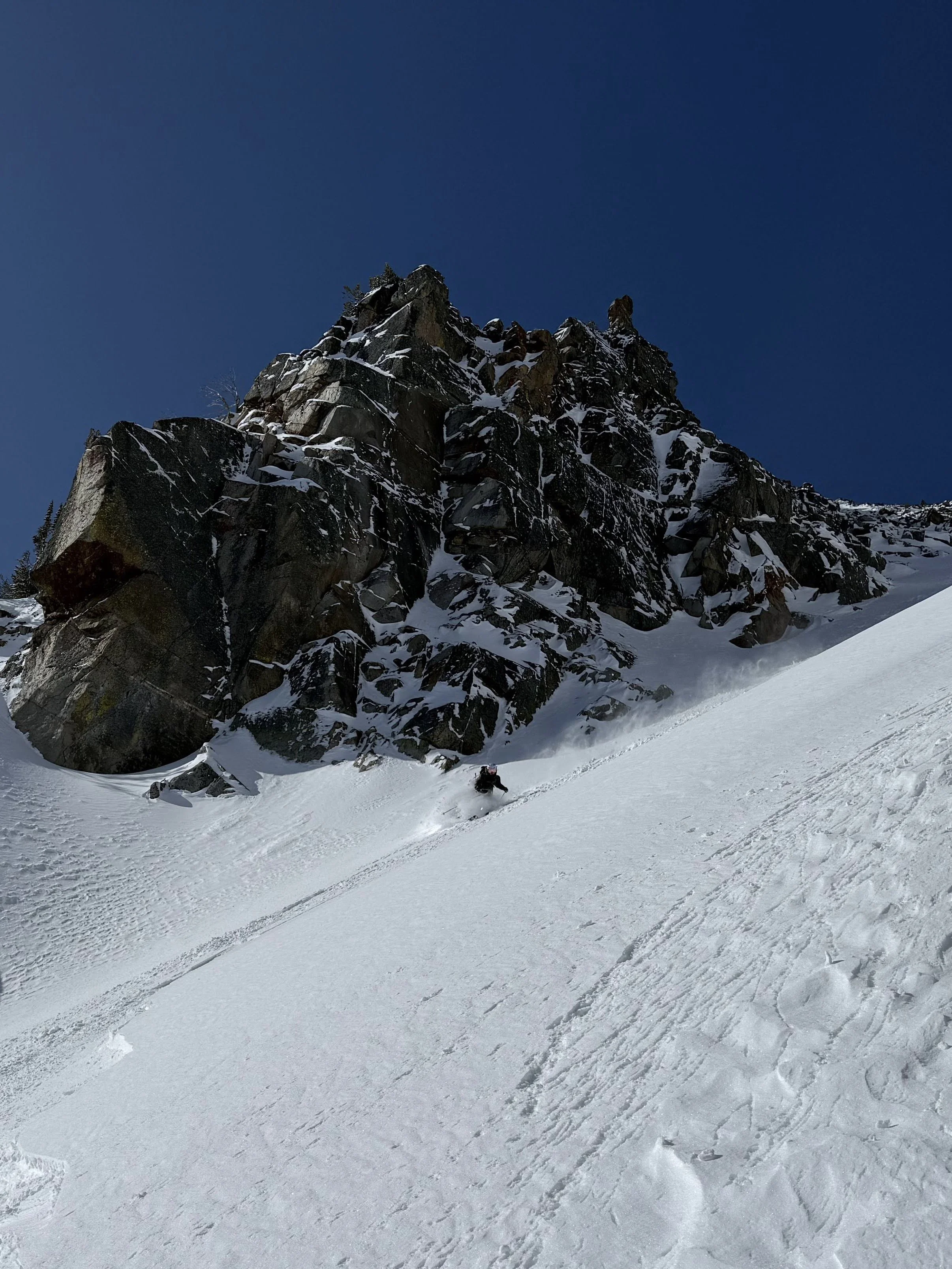 Skier in steep couloir at Bell Lake Yurt