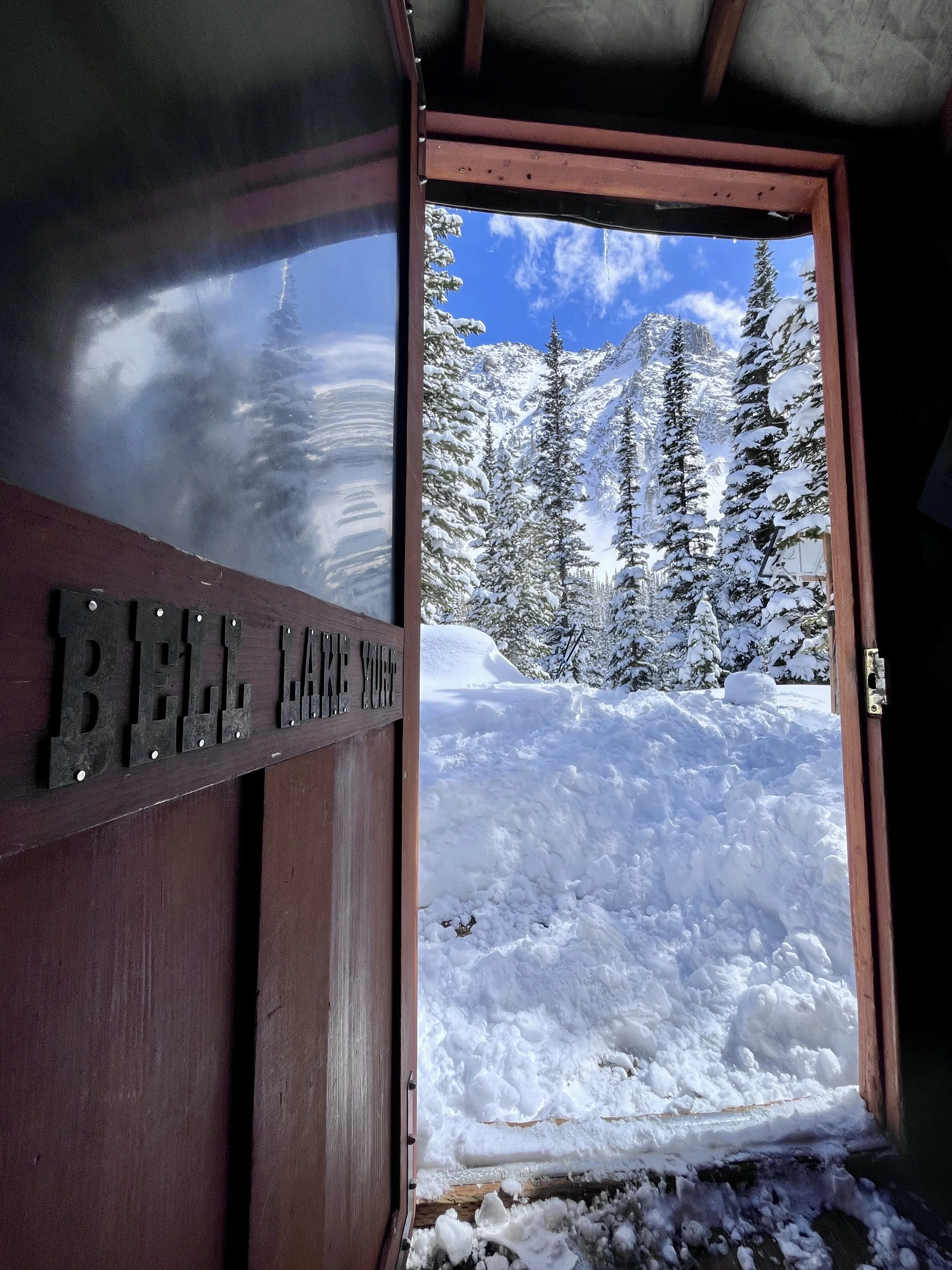 Ski hut snowy front door view