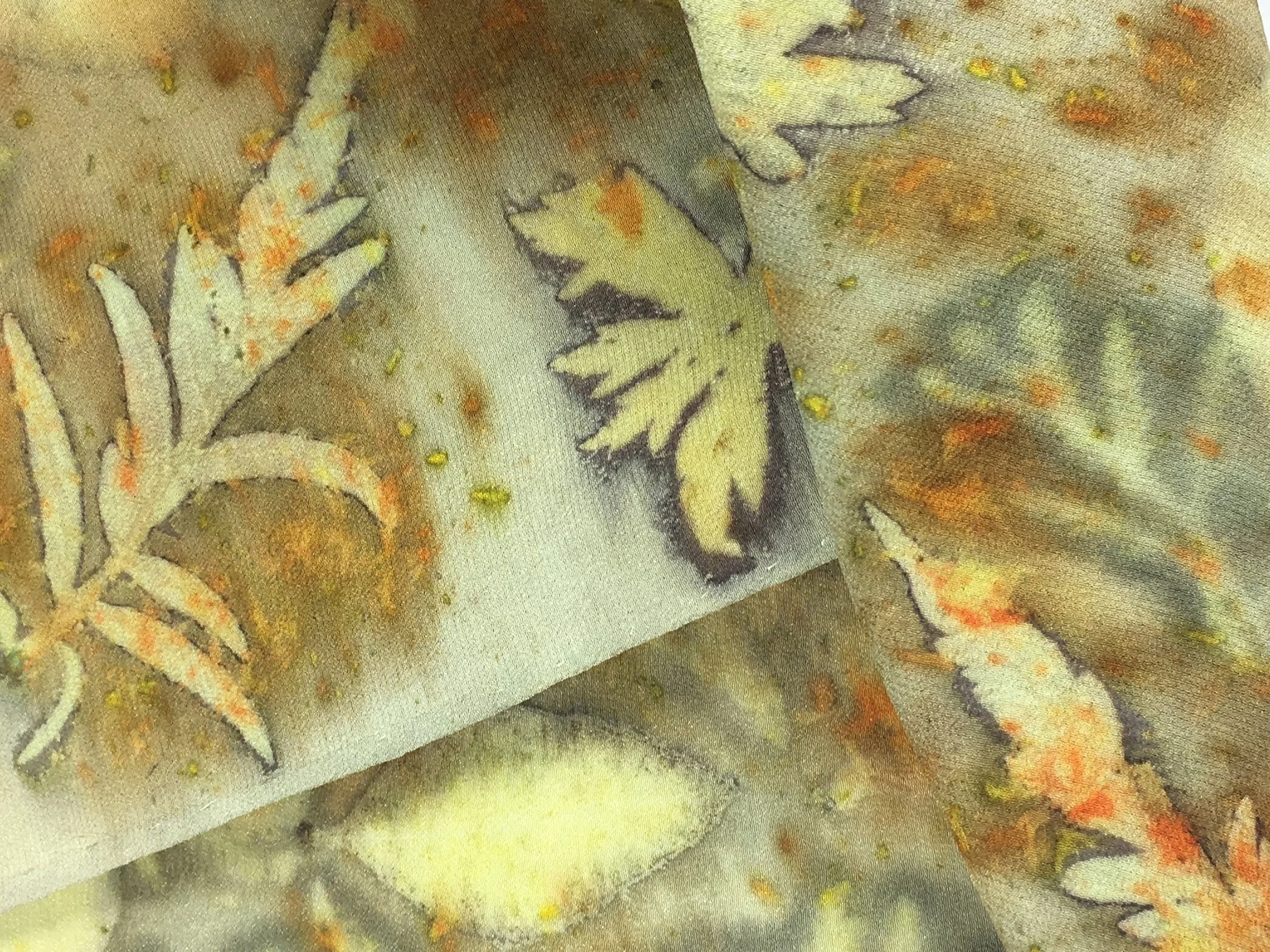  Detail of a silk scarf dyed with Buckthorn and printed with Tiger Eye Sumac, Cranesbill Geranium, Chamomile, Eucalyptus leaves and Cosmos flowers. &nbsp; 