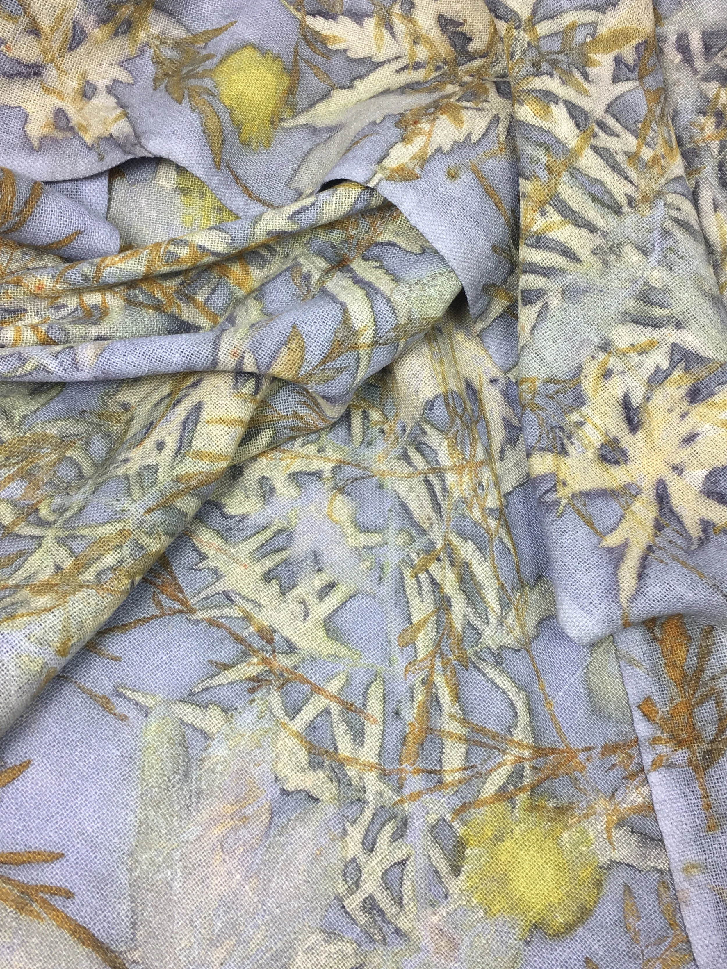 Detail of a 100% raw silk scarf dyed with Logwood and printed with Tigereye Sumac, Dyer’s Chamomile flowers, Coreopsis, Sandcherry and Peony