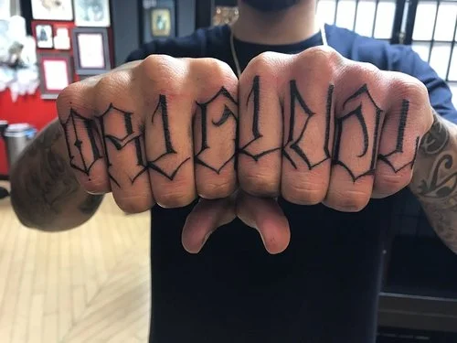 Gangster street lettering on fingers tattoos