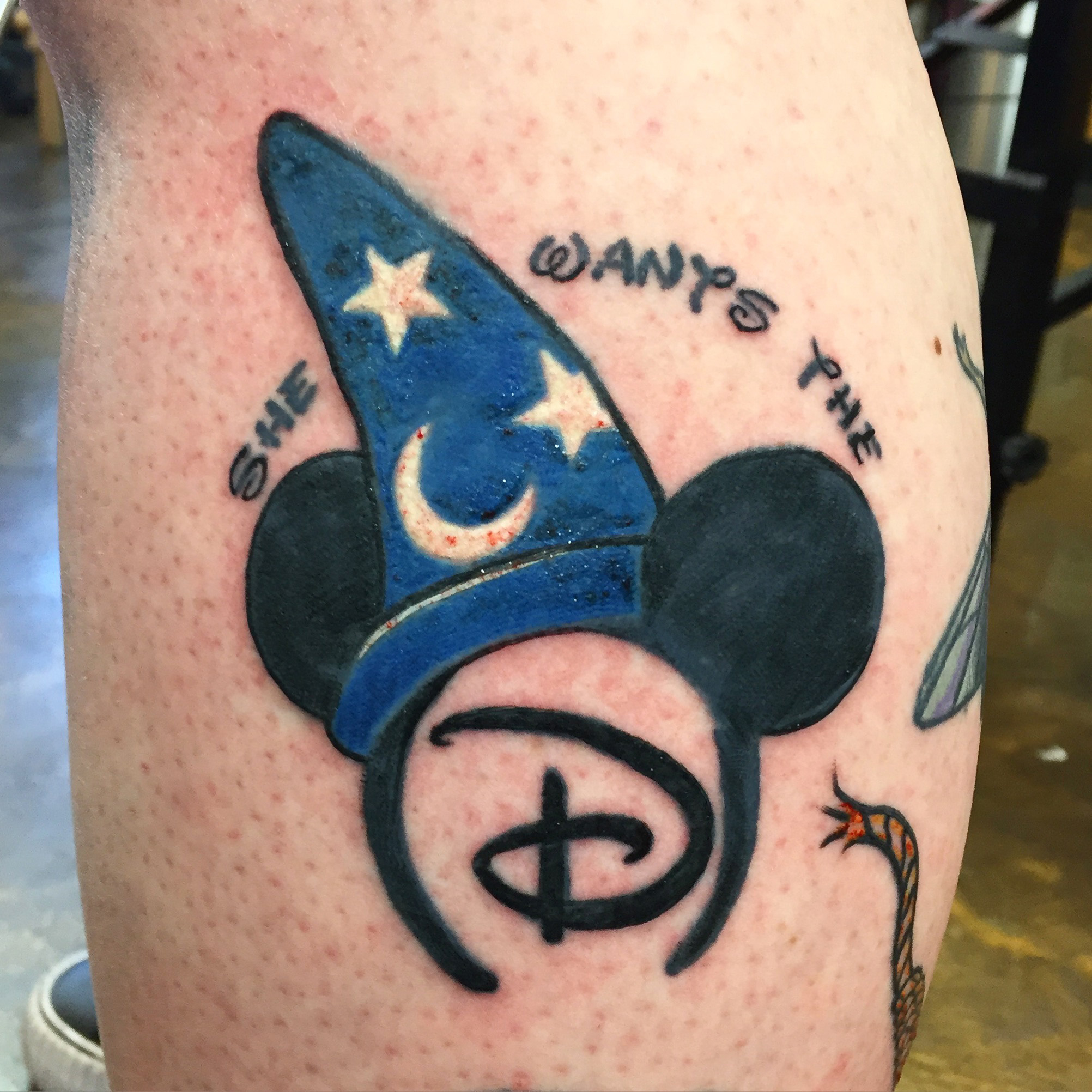 "She wants the D", Dirty Disney Mickey Mouse ears and Fantasia hat. Side calf half leg sleeve tattoo.