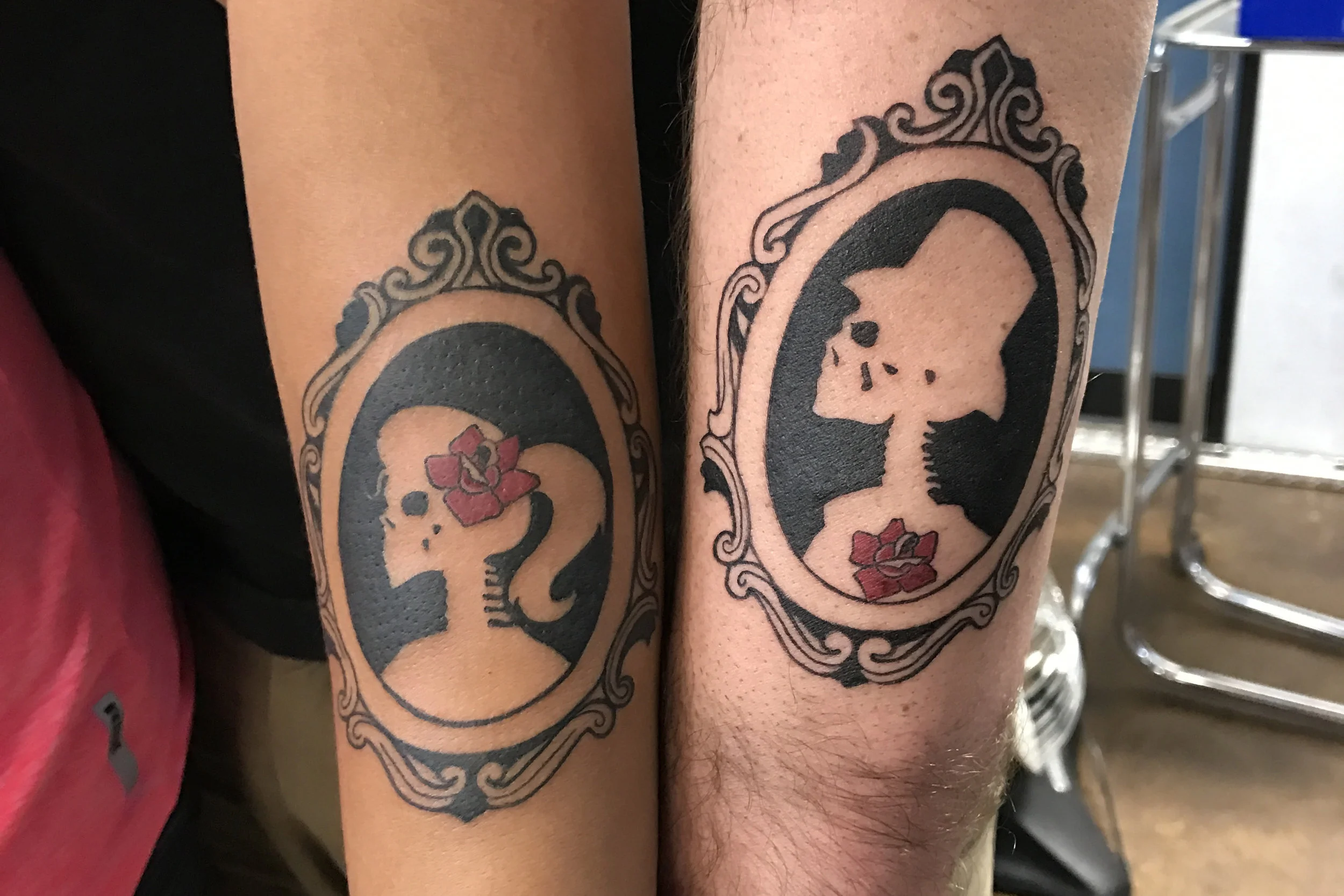 His and hers engagement till death silhouette tattoos black and gray with a matching red rose. Forearm half sleeve tattoos. 