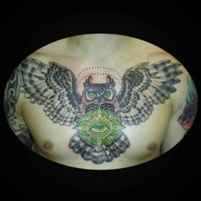 Traditional Owl Chest Tattoo Black and Gray with Green Eye. 